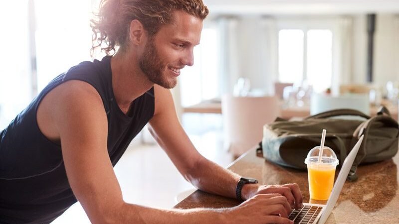 millennial-white-man-checking-fitness-app-on-lapto-9WV83CN-rluadwvui8si98kndc26fcci5ecfmjs0z4tranr3is