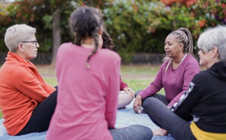 Multi generational women enjoy day outdoor at city park - Multiracial female friendship
