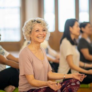 Yoga class Diverse group of adults at a group fitness yoga class.