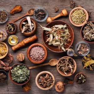 Assorted dried medical herbs Set of healing herbs, plants and medicinal roots.Herbal medicine.Healing herbs on wooden board