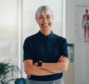 Woman, physiotherapist and portrait in office with confidence, career pride and healthcare service